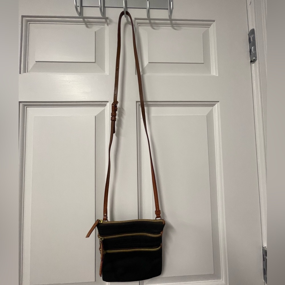 Excellent used condition Dooney & Bourke black nylon multiple pocket crossbody